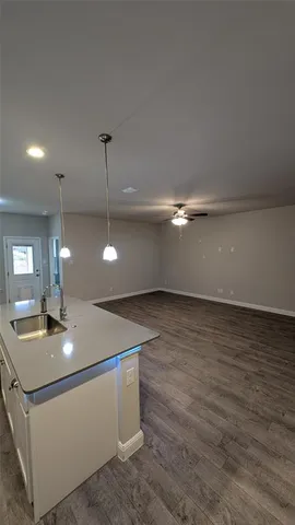 a view of an empty room with a mirror