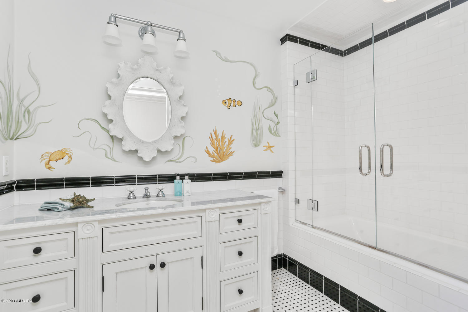 23 Palmer Terrace Riverside, CT 06878 - Photo 23 of 45 a bathroom with a sink vanity mirror and shower