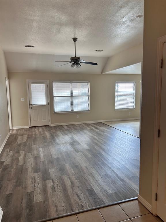722 Rambling Court Granbury, TX 76049 - Photo 2 of 7 Living room featuring wood looking plank floors and ceiling fan
