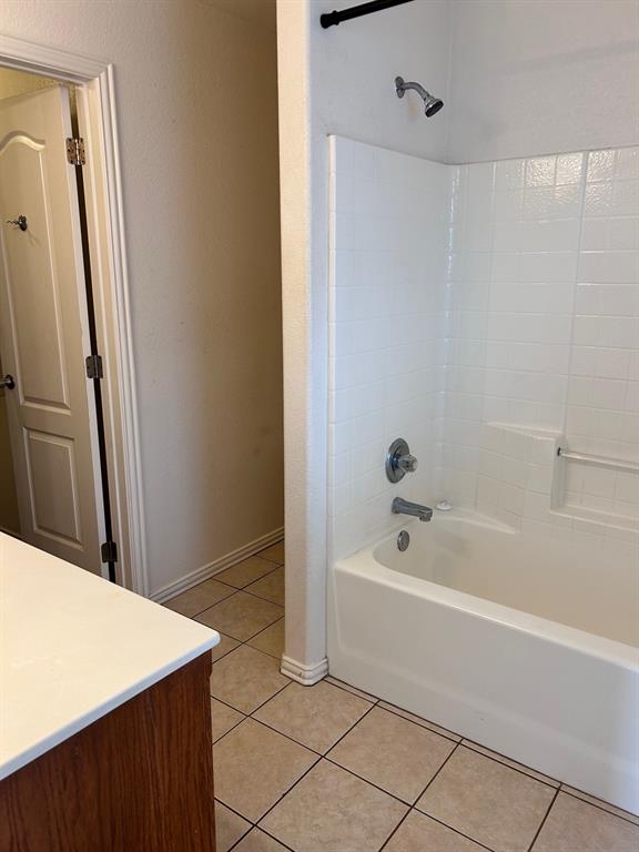 722 Rambling Court Granbury, TX 76049 - Photo 4 of 7 Full bathroom with vanity, shower / washtub combination, and light tile patterned floors