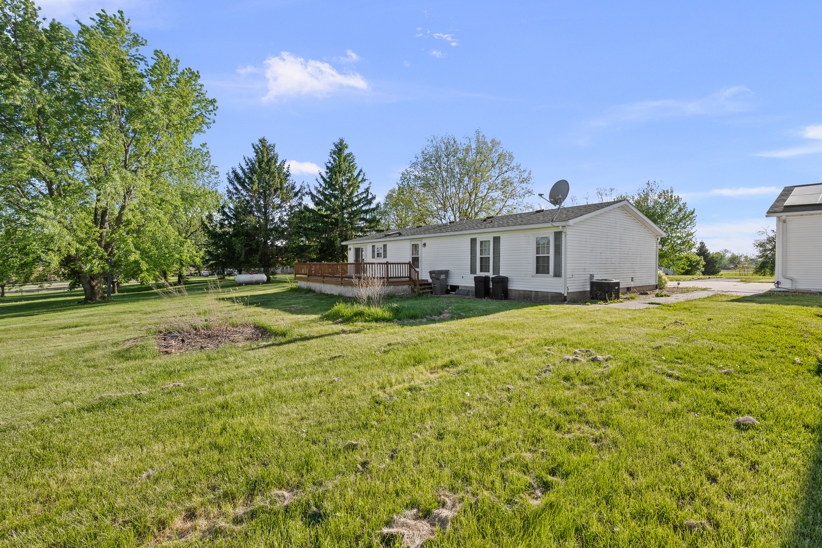 409 233rd Street Aledo, IL 61231 - Photo 13 of 30 a front view of a house with a yard and trees