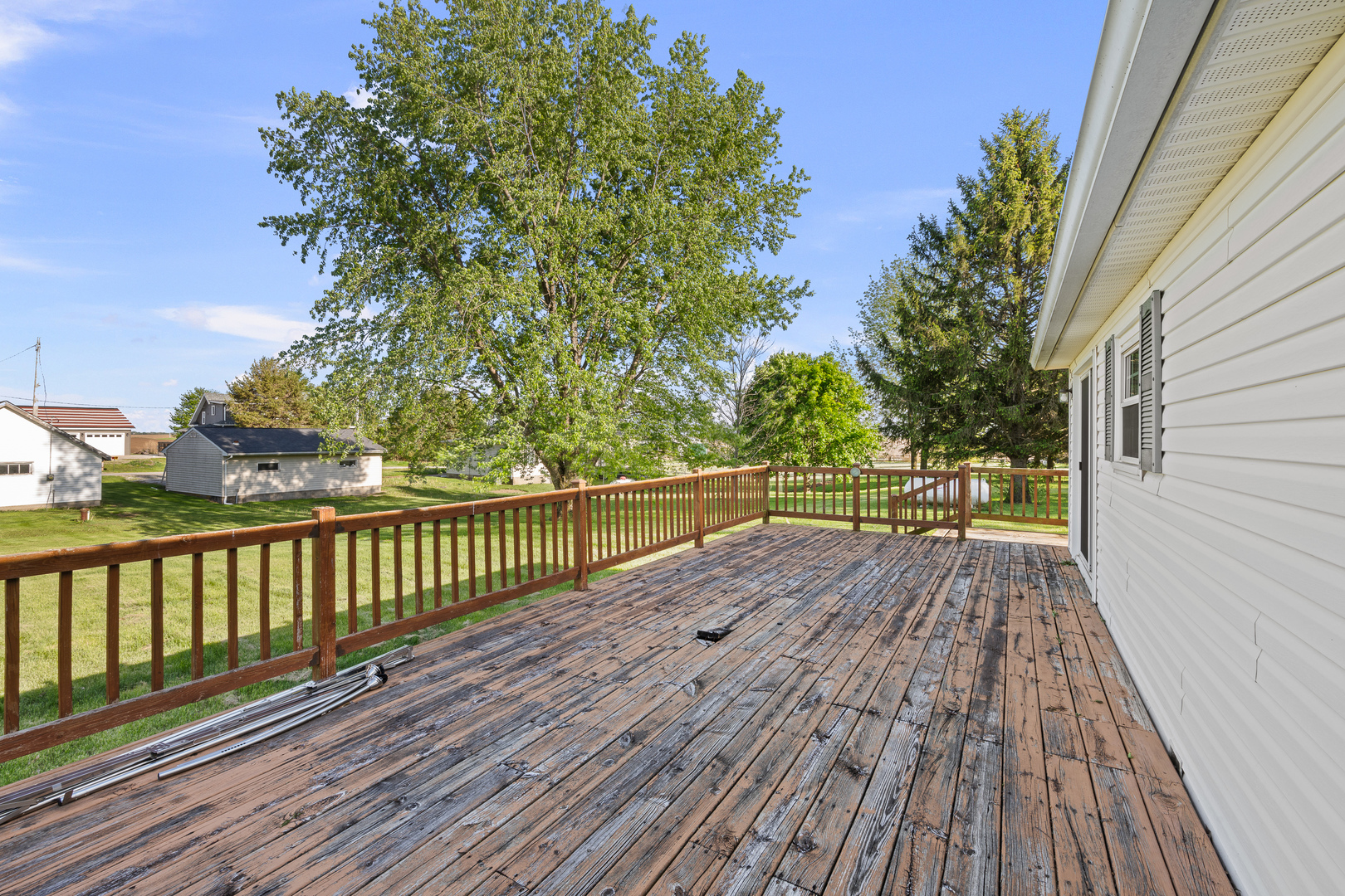 409 233rd Street Aledo, IL 61231 - Photo 14 of 30 a view of balcony with wooden floor and fence