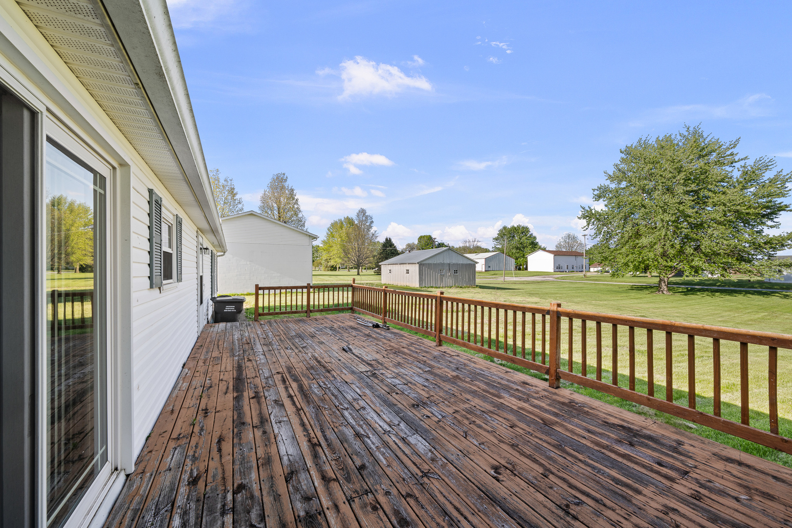 409 233rd Street Aledo, IL 61231 - Photo 15 of 30 a view of balcony with wooden floor and fence