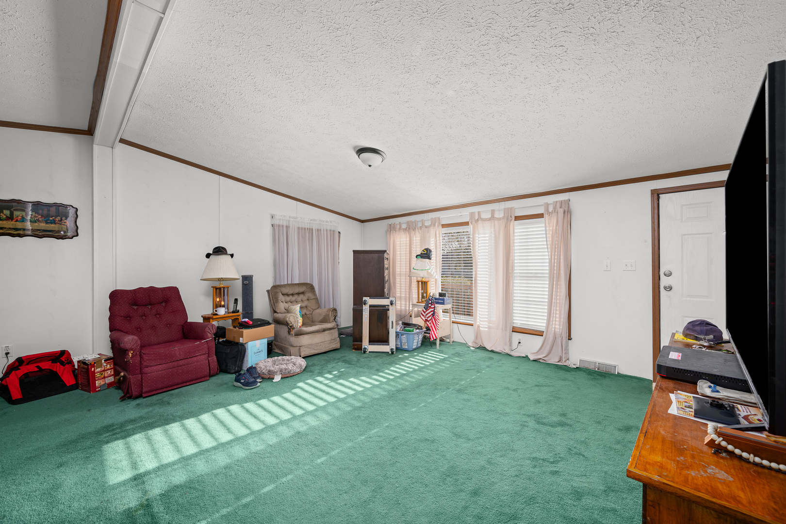 409 233rd Street Aledo, IL 61231 - Photo 17 of 30 a living room with furniture and a flat screen tv