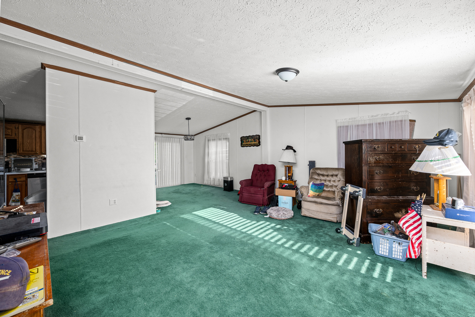 409 233rd Street Aledo, IL 61231 - Photo 18 of 30 a living room with furniture a flat screen tv and a fireplace