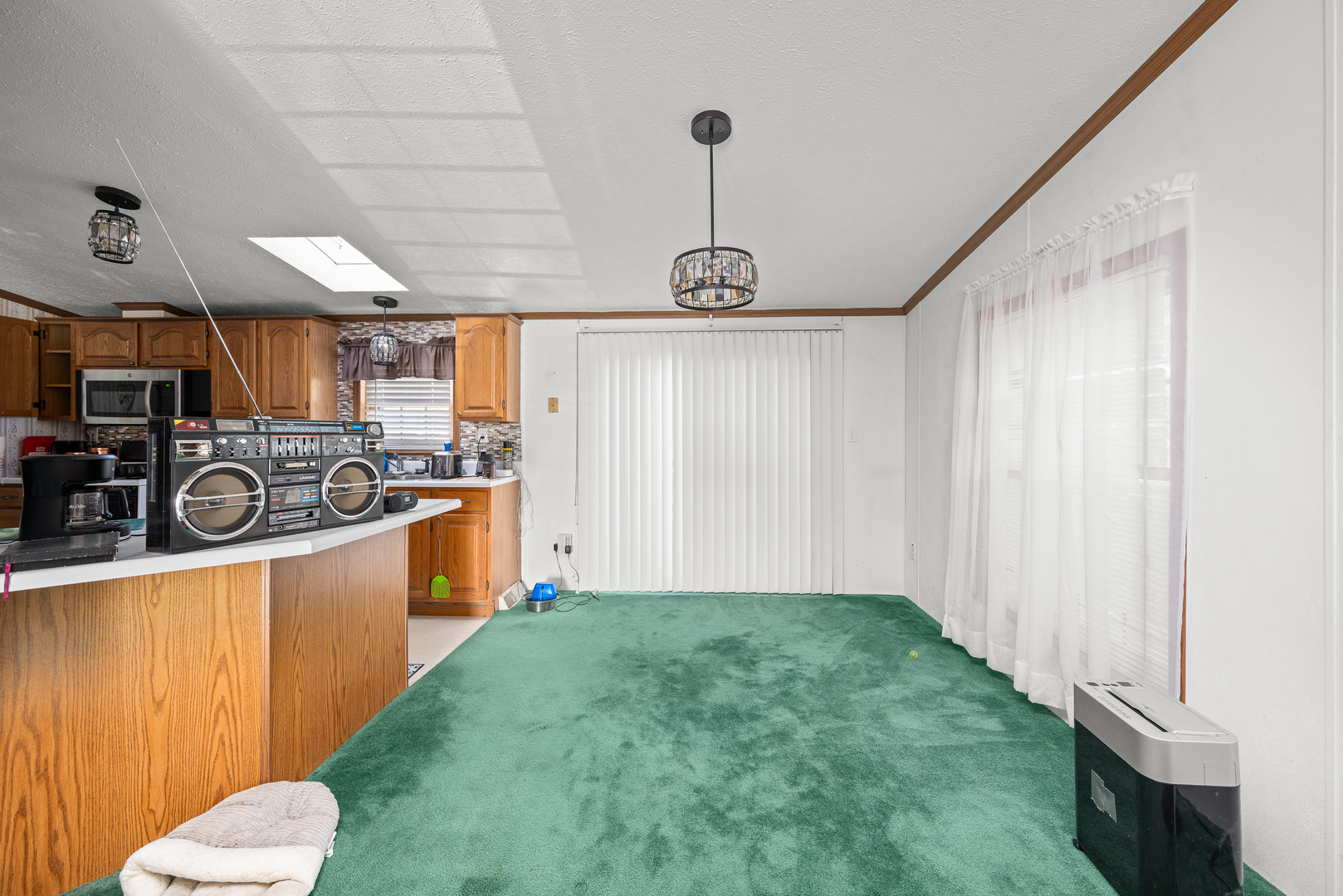 409 233rd Street Aledo, IL 61231 - Photo 19 of 30 a kitchen with stainless steel appliances granite countertop a sink a stove a refrigerator a microwave oven with cabinets