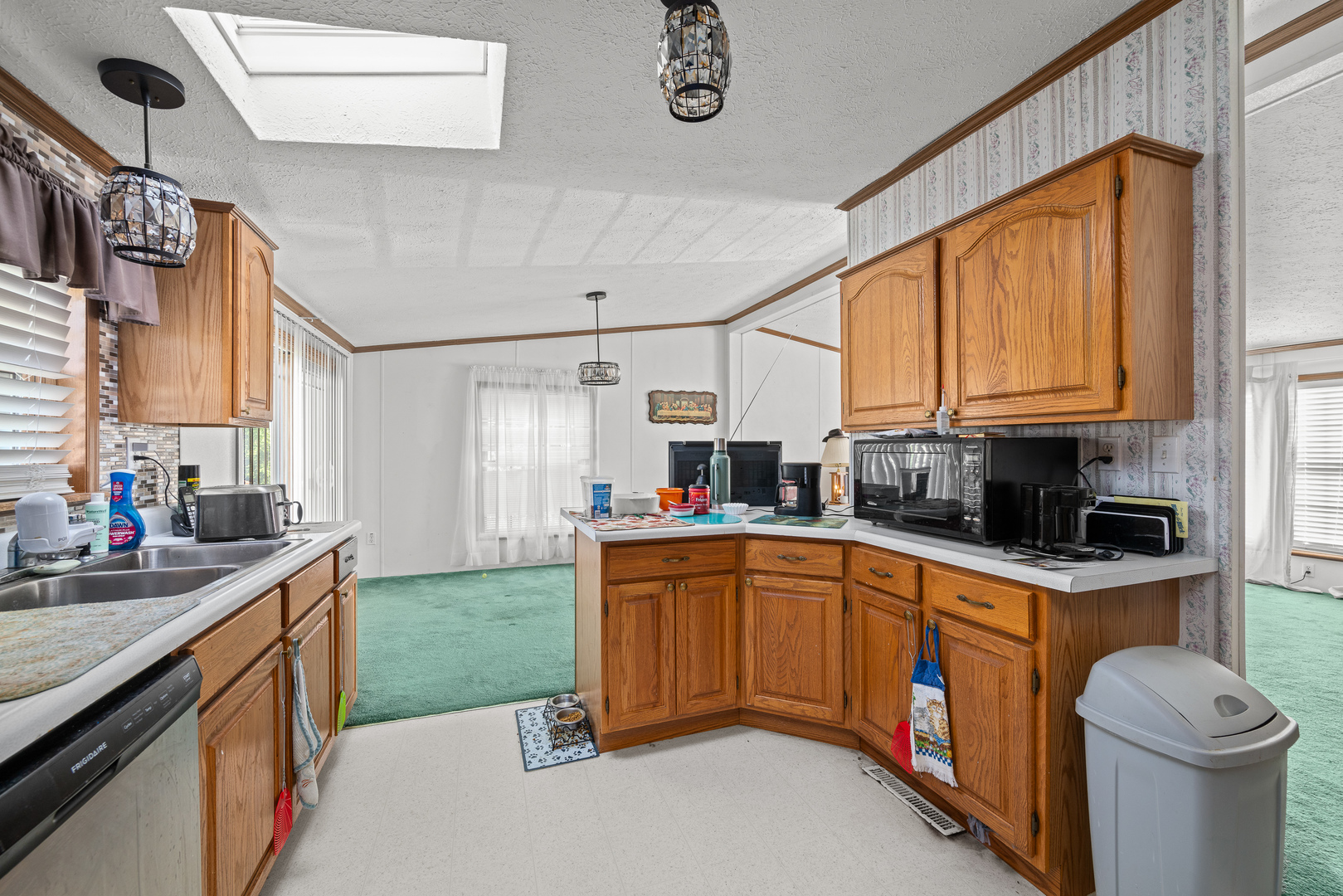 409 233rd Street Aledo, IL 61231 - Photo 21 of 30 a kitchen with a sink cabinets and window