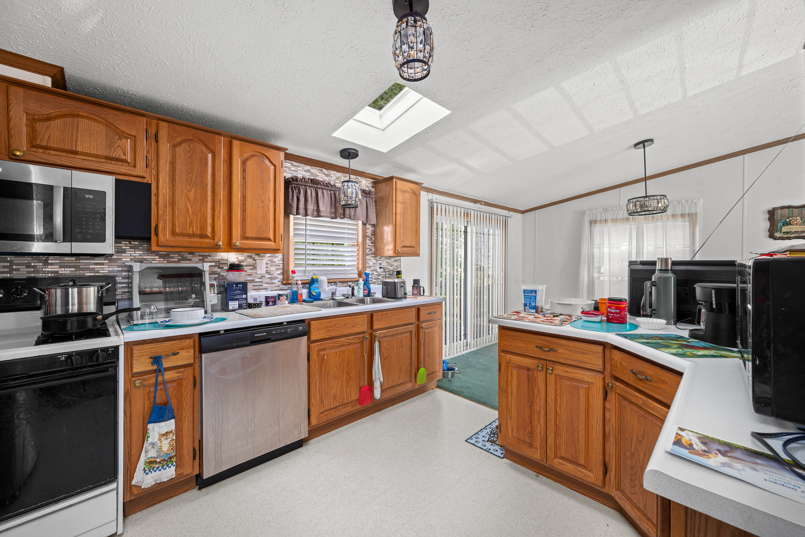 409 233rd Street Aledo, IL 61231 - Photo 22 of 30 a kitchen with cabinets a sink and appliances