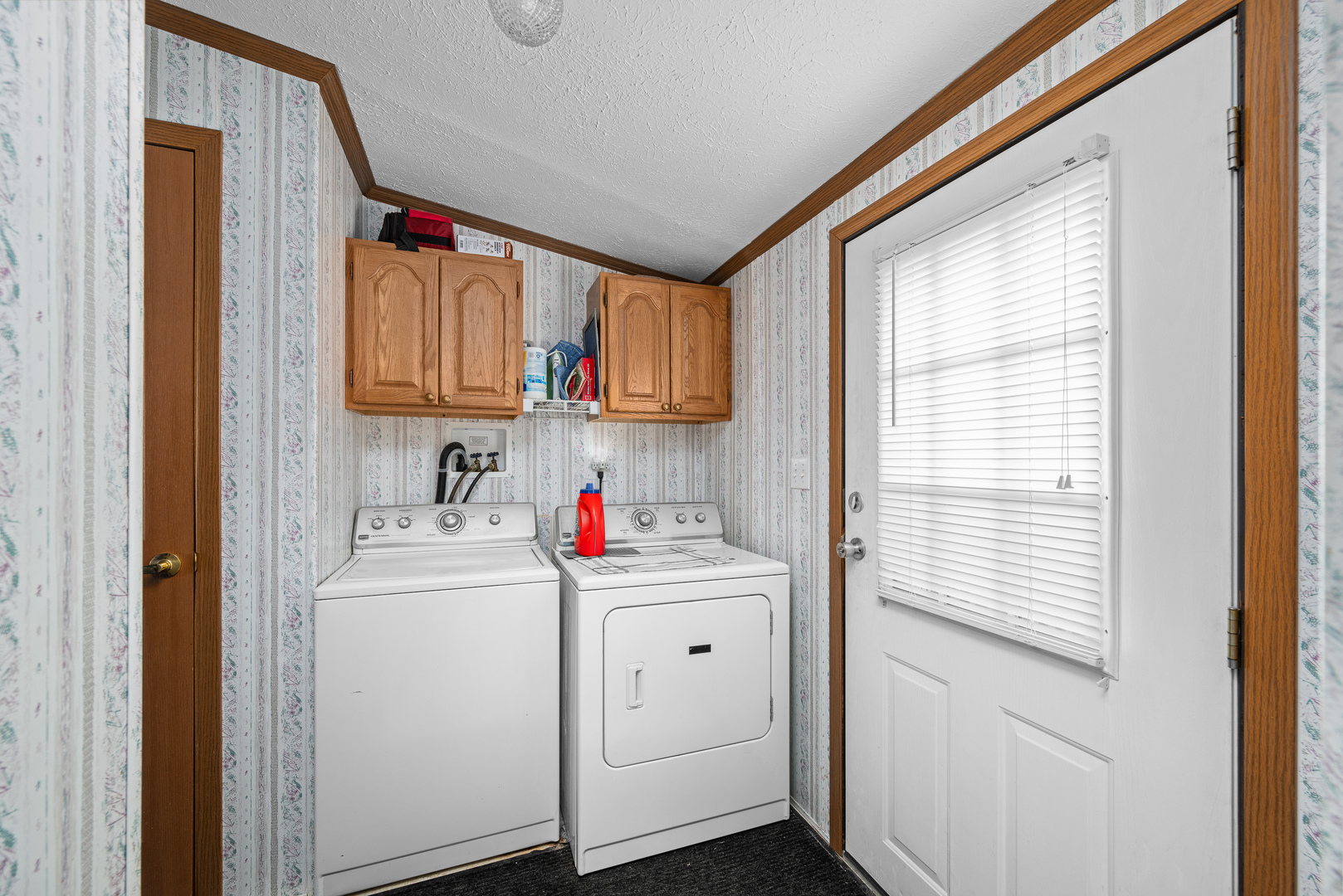 409 233rd Street Aledo, IL 61231 - Photo 24 of 30 a view of storage and utility room with washer and dryer