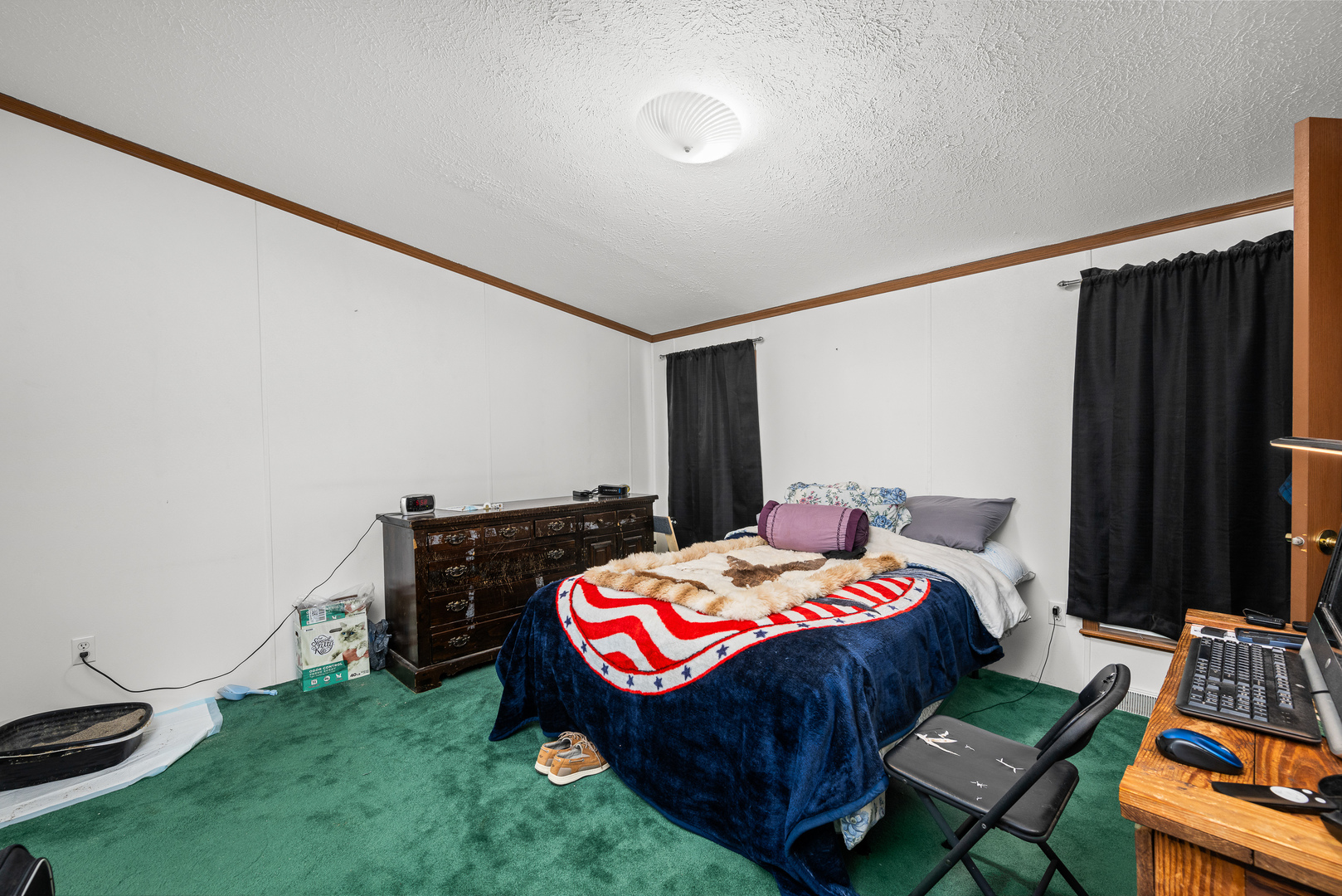 409 233rd Street Aledo, IL 61231 - Photo 29 of 30 a bedroom with a bed and a bookshelf in it