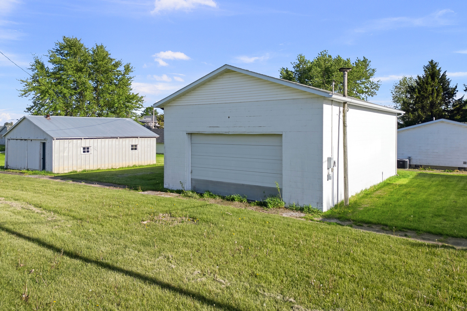 409 233rd Street Aledo, IL 61231 - Photo 5 of 30 a front view of house with yard and trees in the background