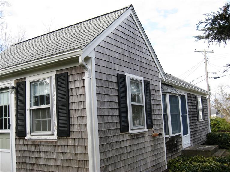 141 Leeward Road Bourne, MA 02532 - Photo 3 of 21 a front view of a house with a yard