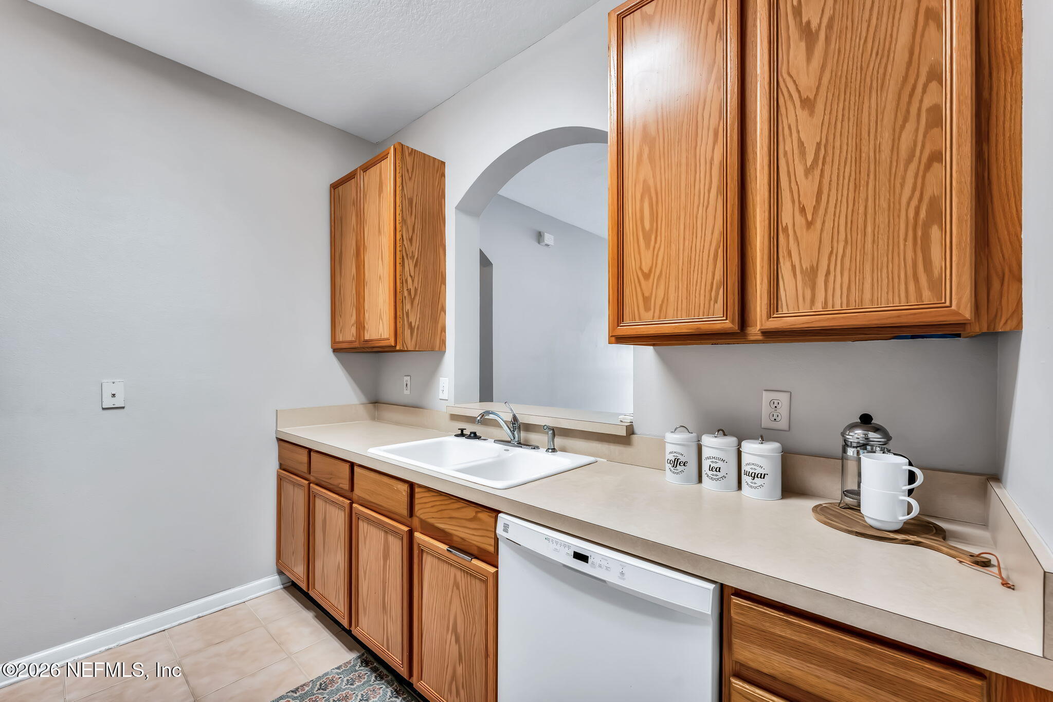 7990 Baymeadows Road East, Unit 520 Jacksonville, FL 32256 - Photo 8 of 41 a kitchen with stainless steel appliances granite countertop a sink a stove and cabinets