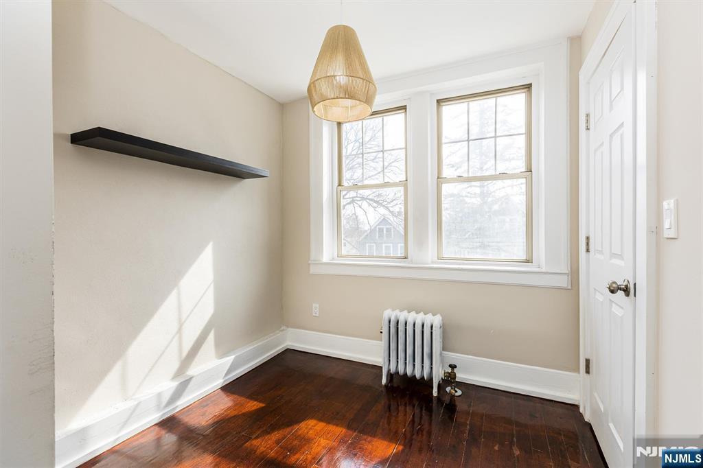 43 Pleasant Way Montclair, NJ 07042 - Photo 14 of 28 a view of a livingroom with wooden floor and a window