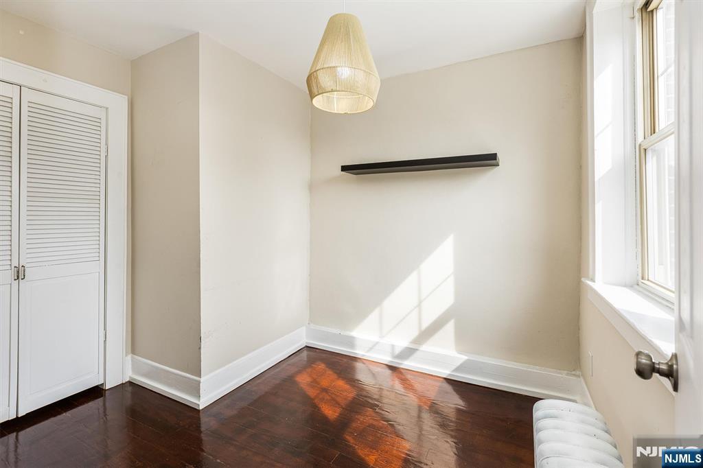 43 Pleasant Way Montclair, NJ 07042 - Photo 16 of 28 a view of a room with wooden floor and windows
