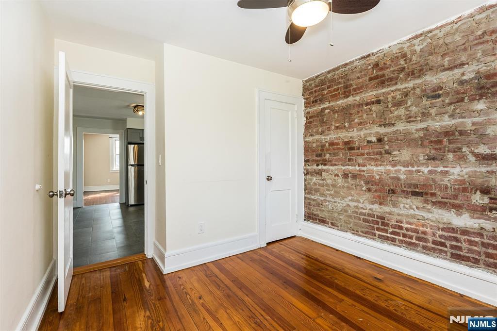 43 Pleasant Way Montclair, NJ 07042 - Photo 19 of 28 wooden floor in an empty room