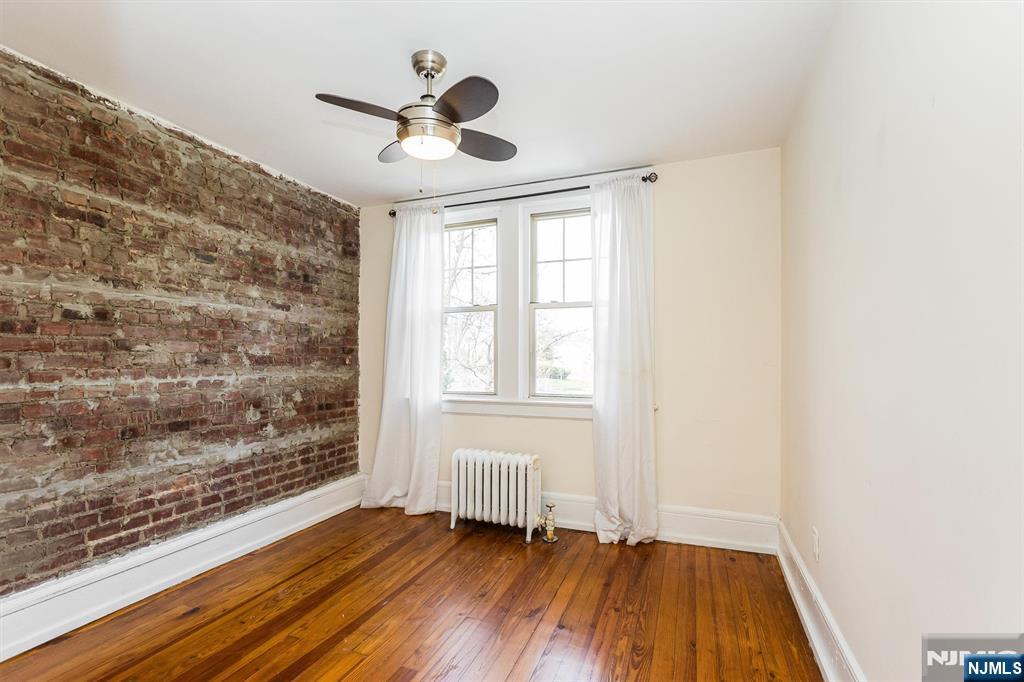 43 Pleasant Way Montclair, NJ 07042 - Photo 20 of 28 wooden floor in an empty room with a window