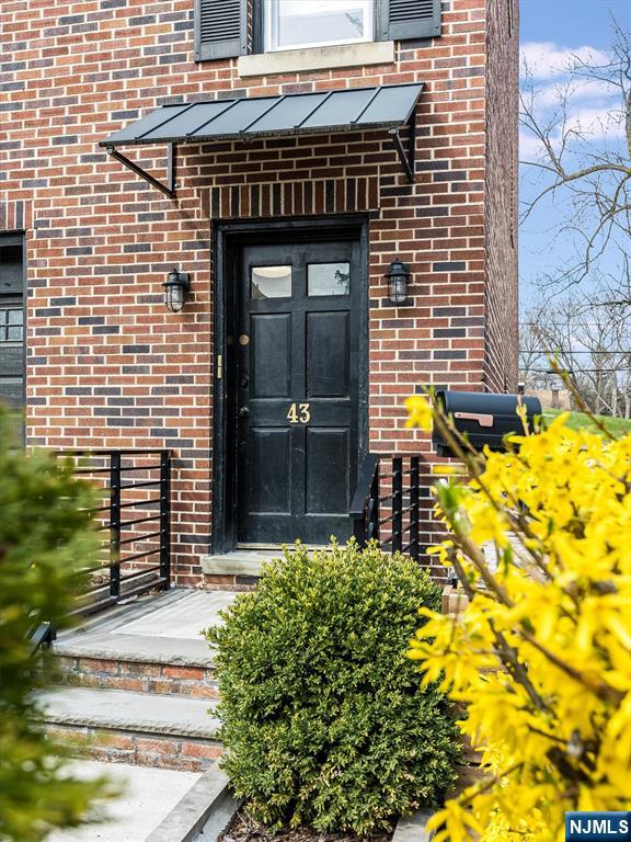 43 Pleasant Way Montclair, NJ 07042 - Photo 3 of 28 a front view of a house with a garden