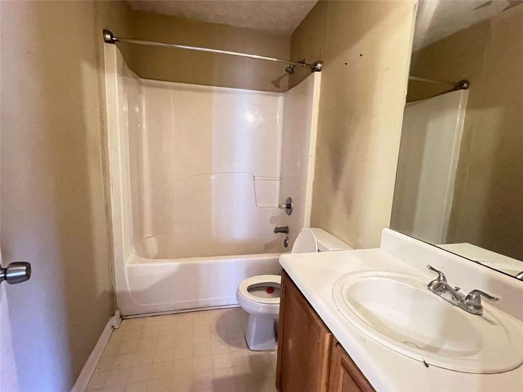 3716 Cress Way Drive Decatur, GA 30034 - Photo 15 of 20 a bathroom with a granite countertop sink toilet and shower
