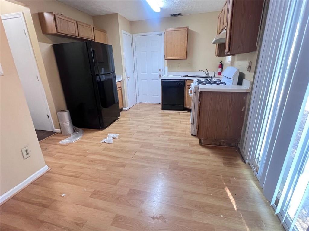 3716 Cress Way Drive Decatur, GA 30034 - Photo 8 of 20 a kitchen with granite countertop a refrigerator and a sink