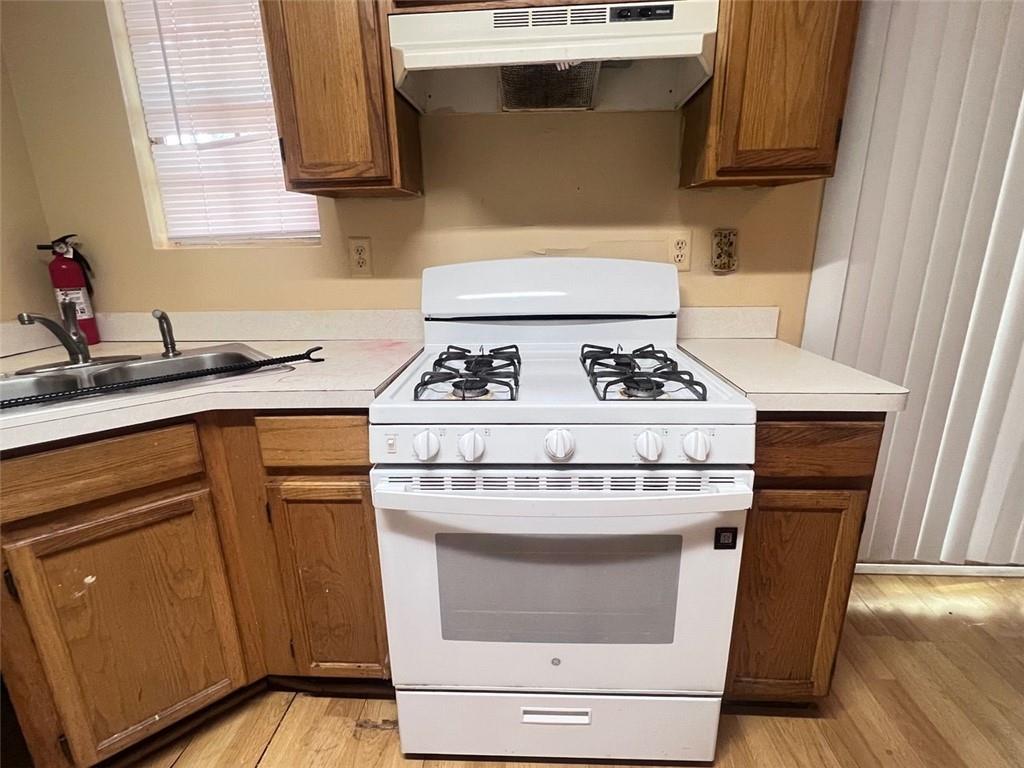 3716 Cress Way Drive Decatur, GA 30034 - Photo 10 of 20 a kitchen with stainless steel appliances granite countertop a stove a sink and a microwave