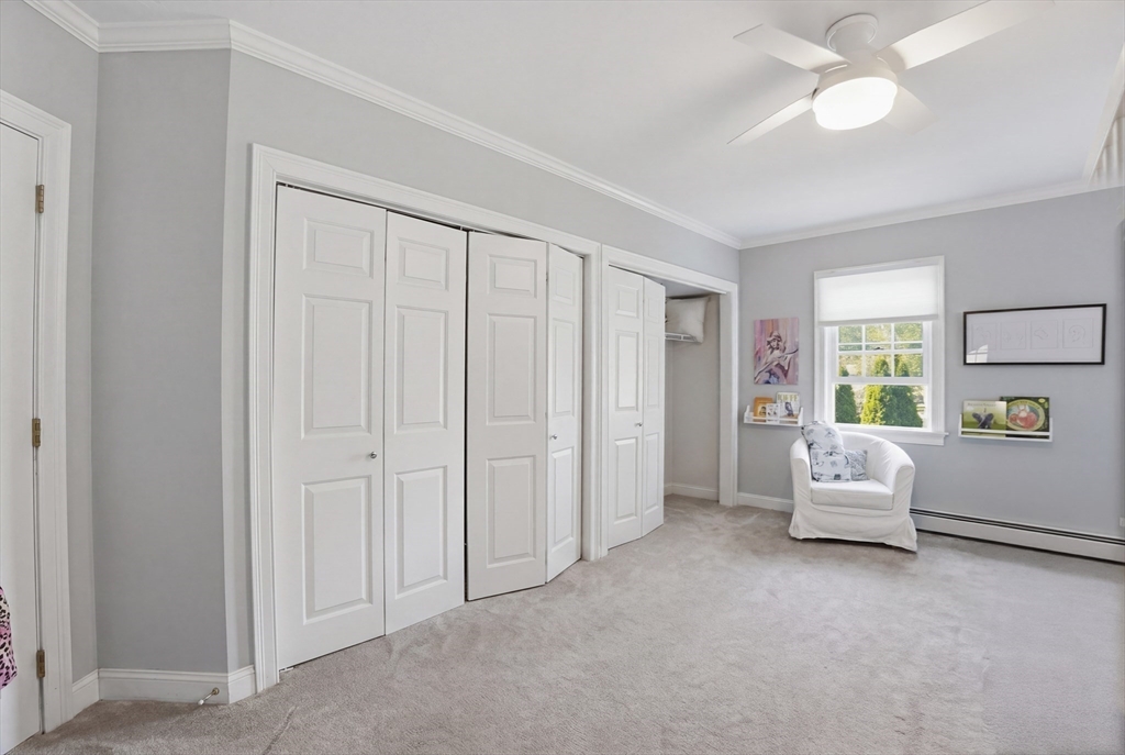 183 Whiting Street Hanover, MA 02339 - Photo 24 of 42 a hallway with furniture and white doors