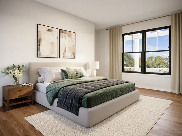 a bedroom with a large bed and a window