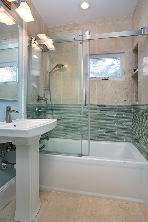 60 Evans Road Brookline, MA 02445 - Photo 12 of 15 a bathroom with a bathtub and a sink