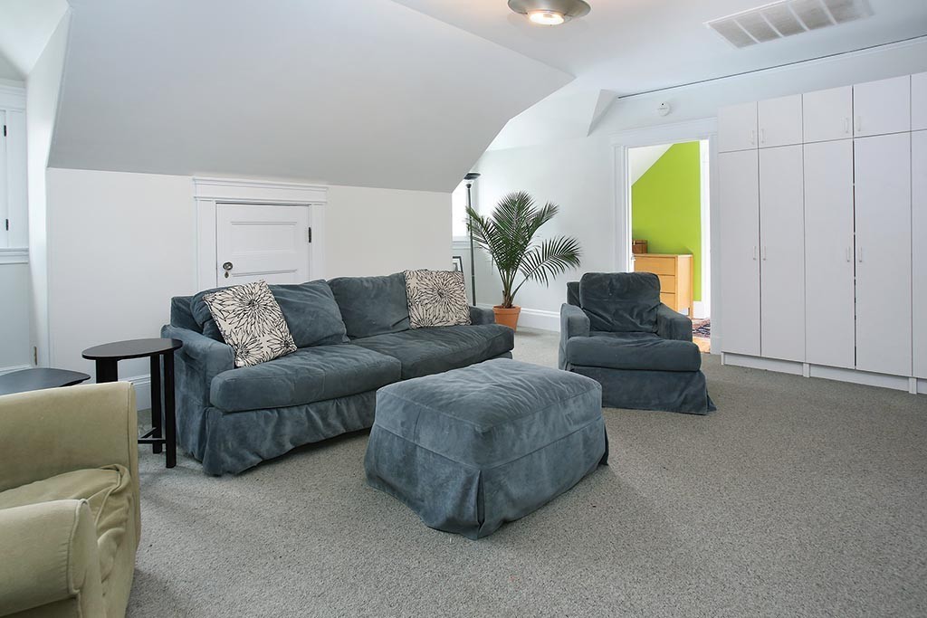 60 Evans Road Brookline, MA 02445 - Photo 13 of 15 a living room with furniture and a potted plant