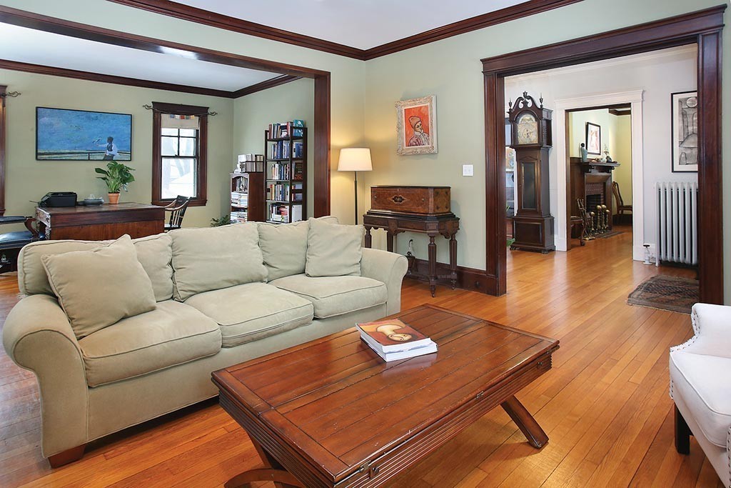 60 Evans Road Brookline, MA 02445 - Photo 3 of 15 a living room with furniture and a wooden floor