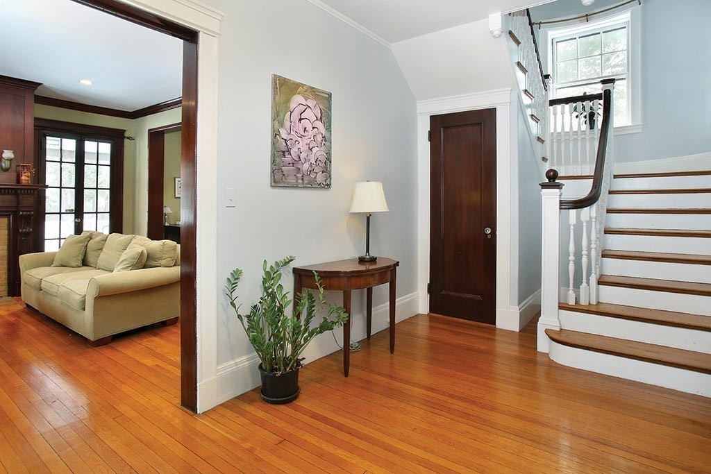 60 Evans Road Brookline, MA 02445 - Photo 4 of 15 a living room with furniture and a wooden floor