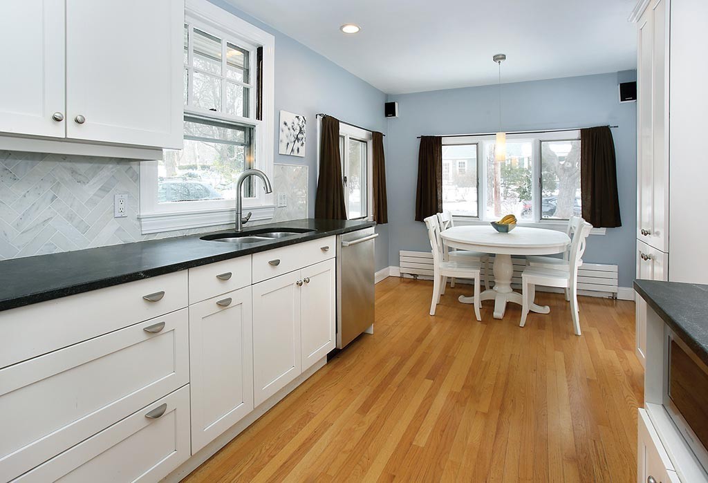 60 Evans Road Brookline, MA 02445 - Photo 6 of 15 a kitchen with a sink and wooden floor