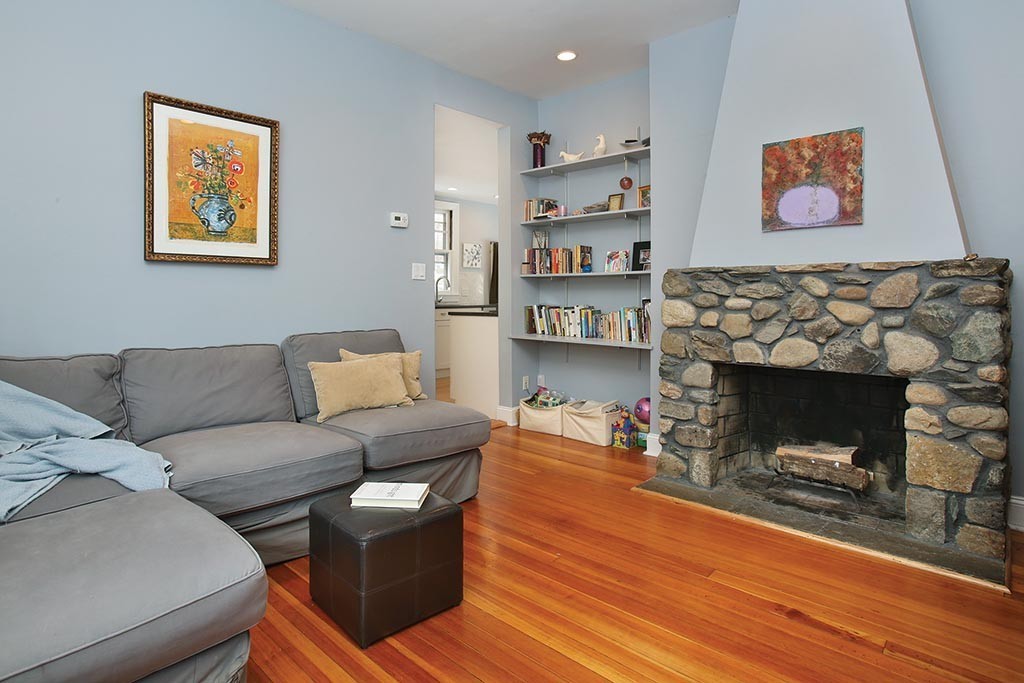 60 Evans Road Brookline, MA 02445 - Photo 8 of 15 a living room with furniture and a fireplace