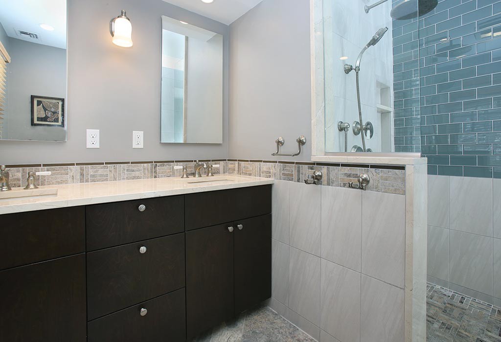 60 Evans Road Brookline, MA 02445 - Photo 10 of 15 a bathroom with a sink and a mirror