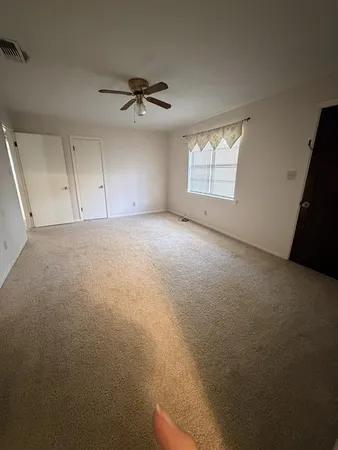 a view of empty room with windows