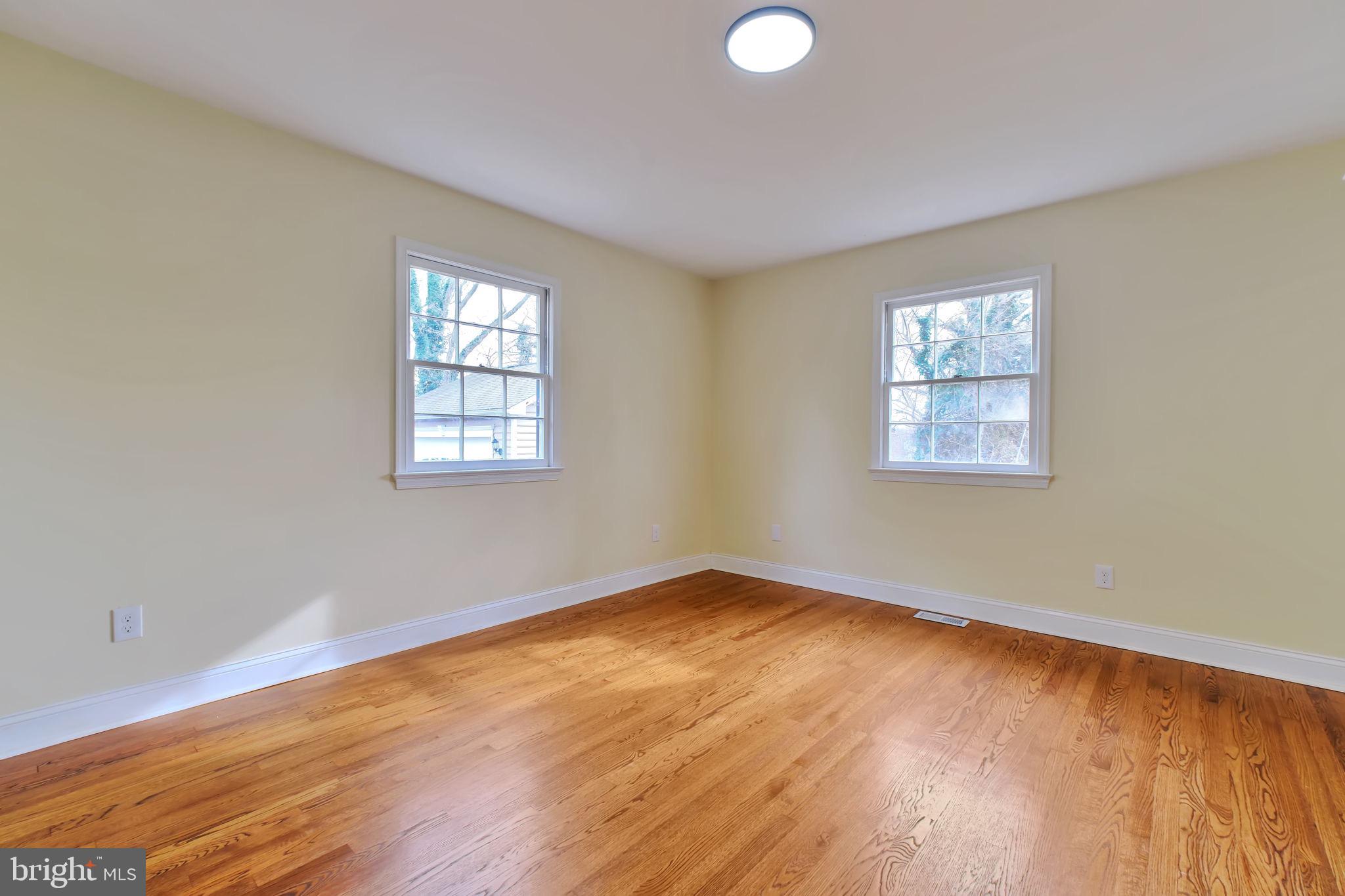 3509 Annandale Road Annandale, VA 22003 - Photo 13 of 26 an empty room with wooden floor and windows