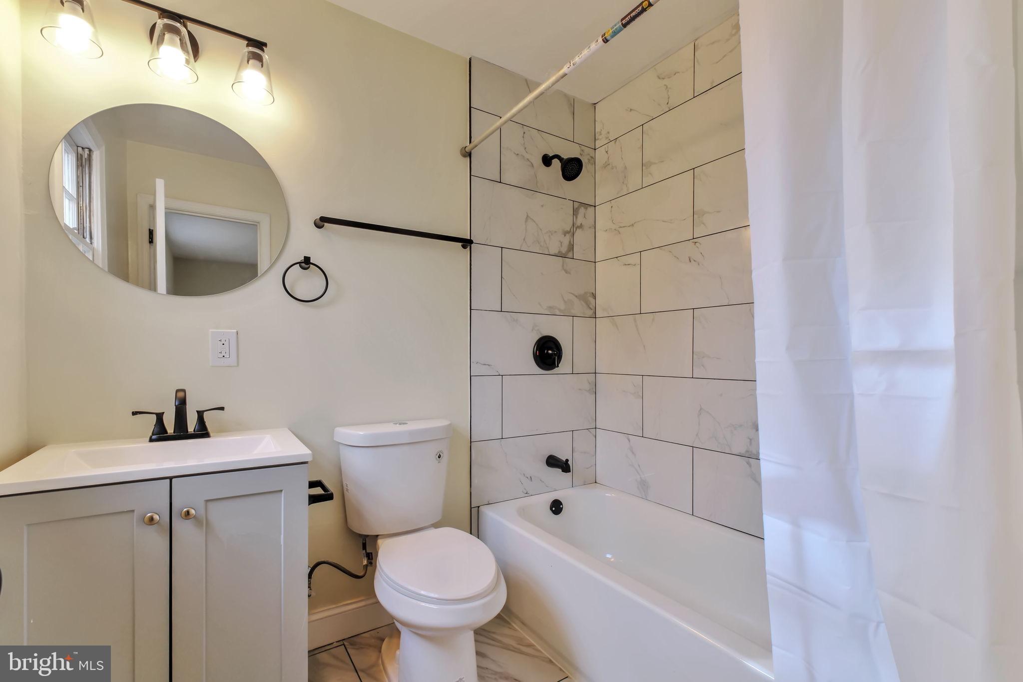 3509 Annandale Road Annandale, VA 22003 - Photo 15 of 26 a bathroom with a sink toilet and shower