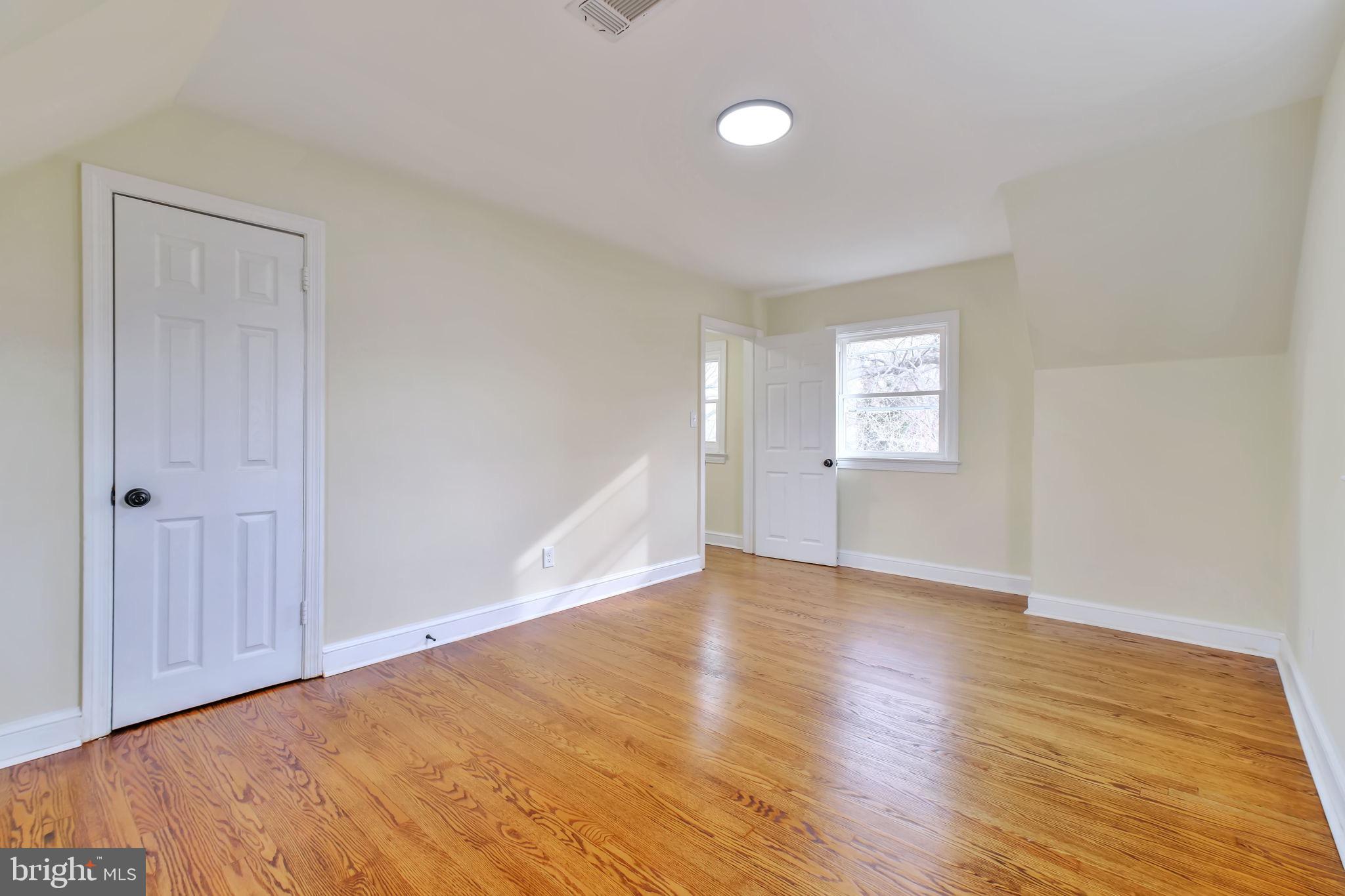 3509 Annandale Road Annandale, VA 22003 - Photo 17 of 26 a view of an empty room with wooden floor and a window
