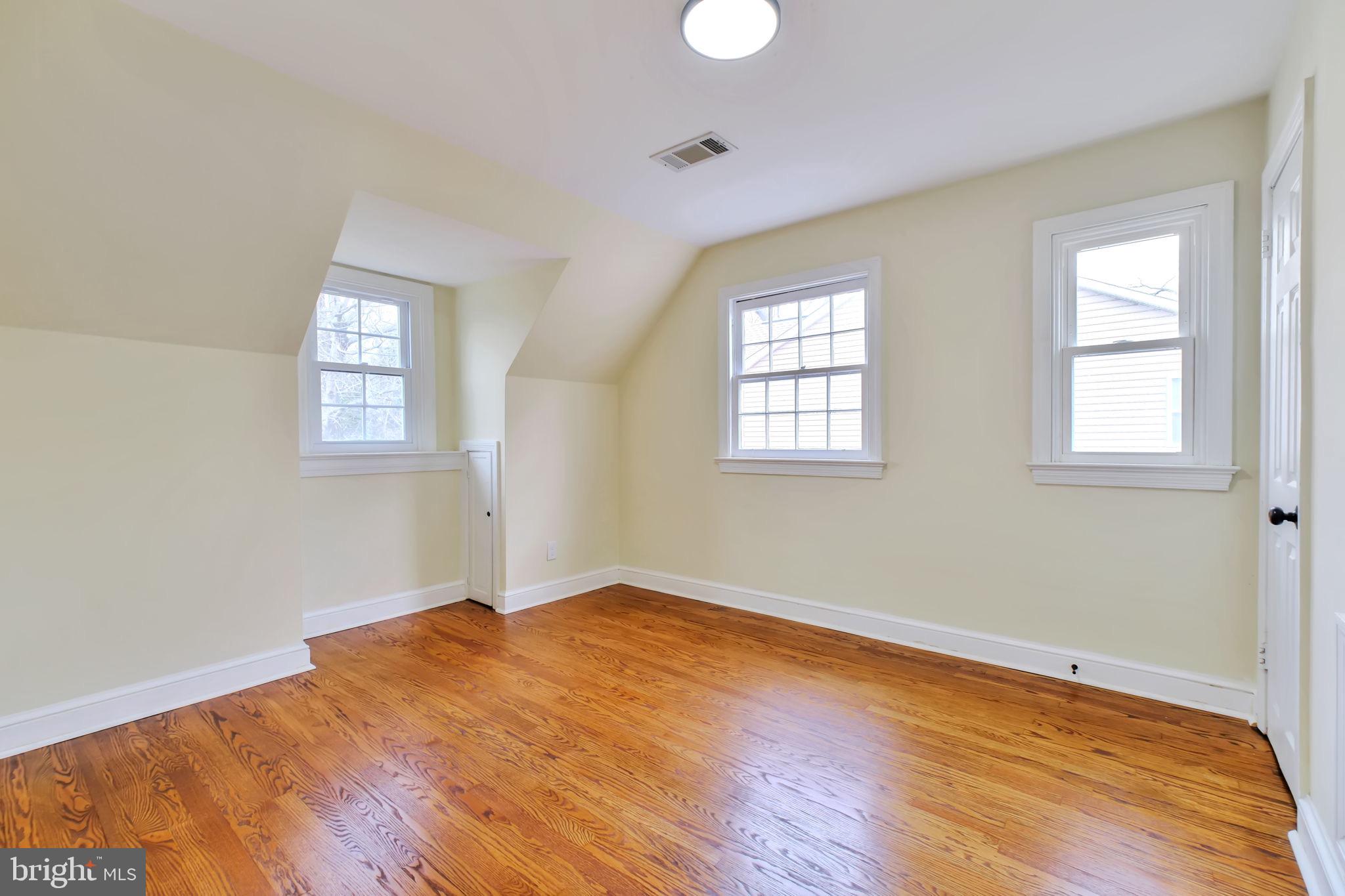 3509 Annandale Road Annandale, VA 22003 - Photo 18 of 26 an empty room with wooden floor and windows