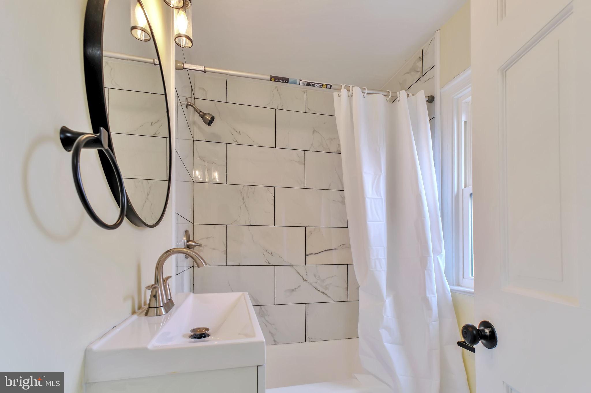 3509 Annandale Road Annandale, VA 22003 - Photo 20 of 26 a bathroom with a shower and a sink