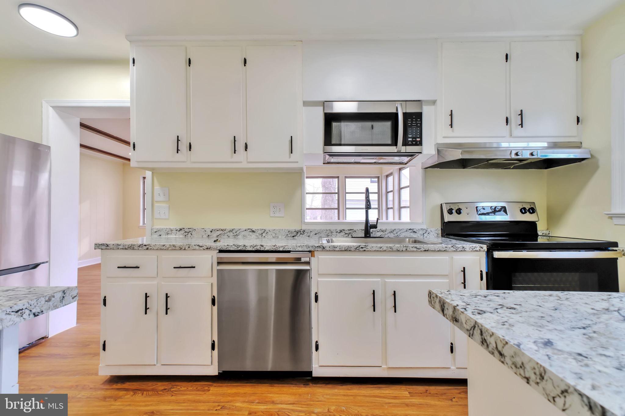 3509 Annandale Road Annandale, VA 22003 - Photo 6 of 26 a kitchen with stainless steel appliances granite countertop a stove and a sink
