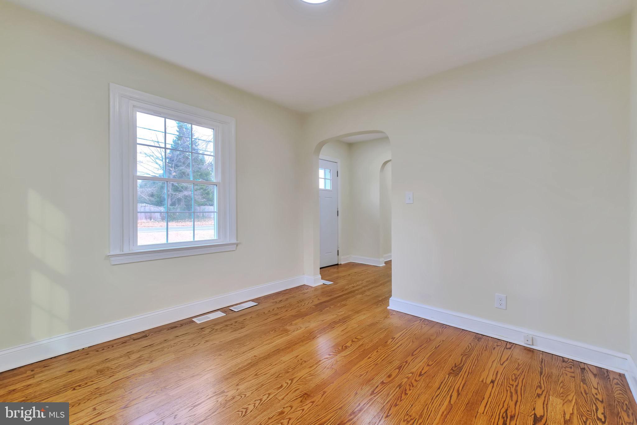 3509 Annandale Road Annandale, VA 22003 - Photo 10 of 26 an empty room with wooden floor and windows