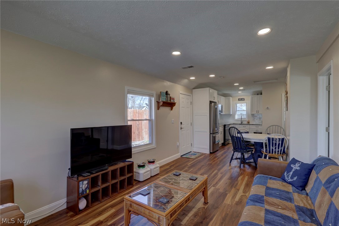 189 Harcourt Road Vermilion, OH 44089 - Photo 6 of 36 Living area with dark wood-style flooring, plenty of natural light, and recessed lighting