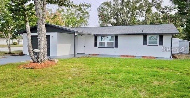 a front view of house with yard and seating space