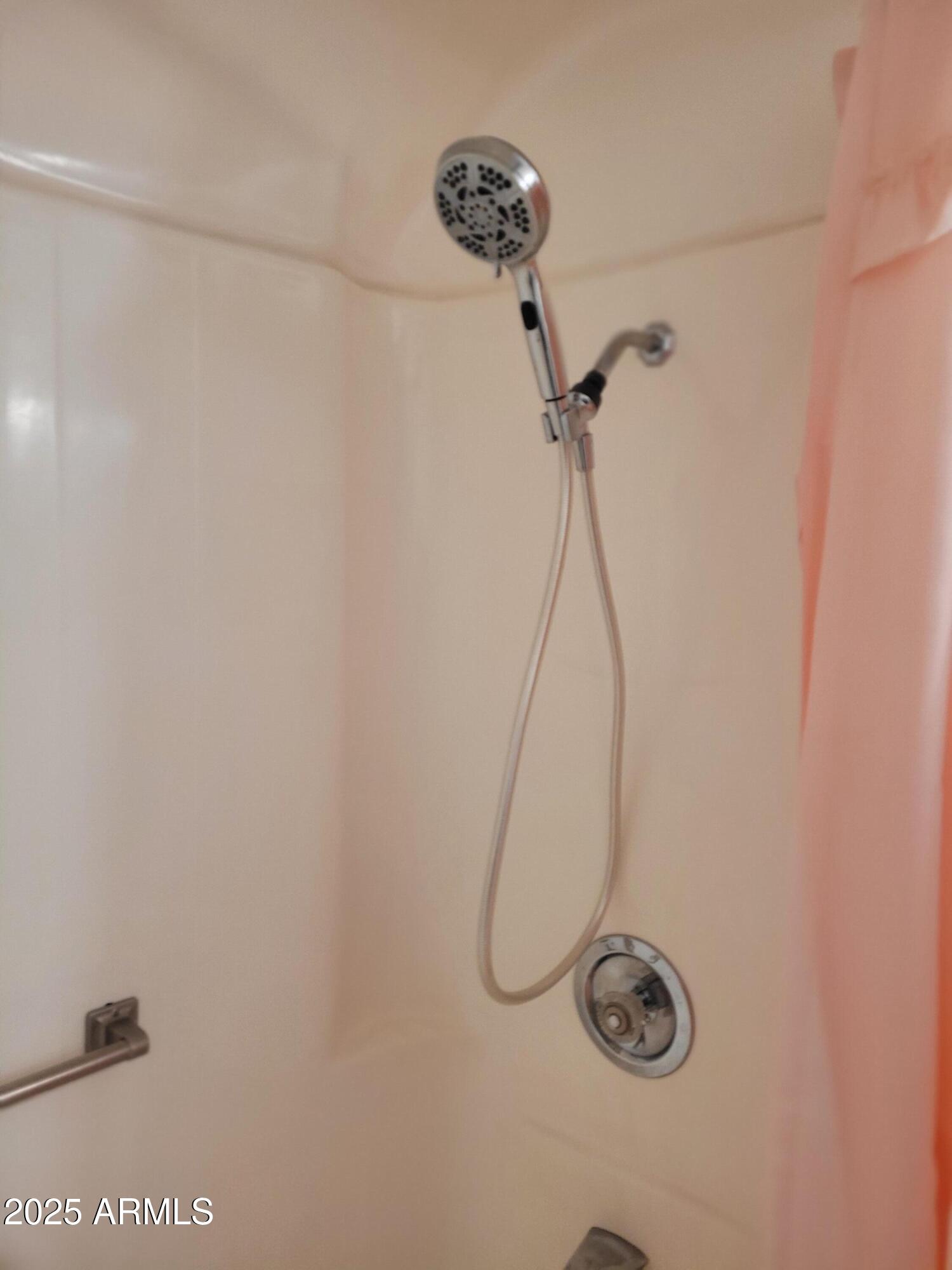 10060 West Royal Oak Road, Unit B Sun City, AZ 85351 - Photo 11 of 26 a bathroom with a shower