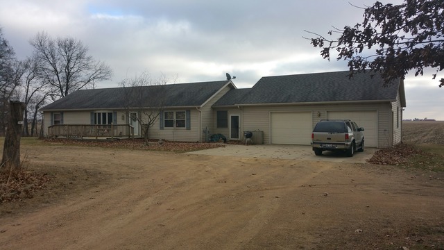 a front view of a house with parking space