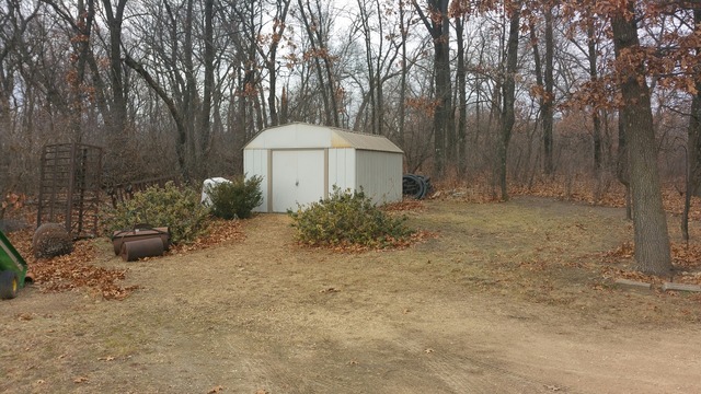 1885 Tower Road Sublette, IL 61367 - Photo 11 of 14 a backyard of a house with a small yard and outdoor seating