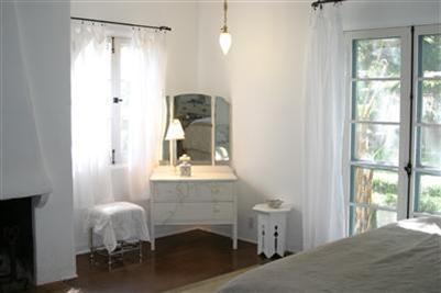410 Tico Road Ojai, CA 93023 - Photo 7 of 10 a bedroom with a bed and a window