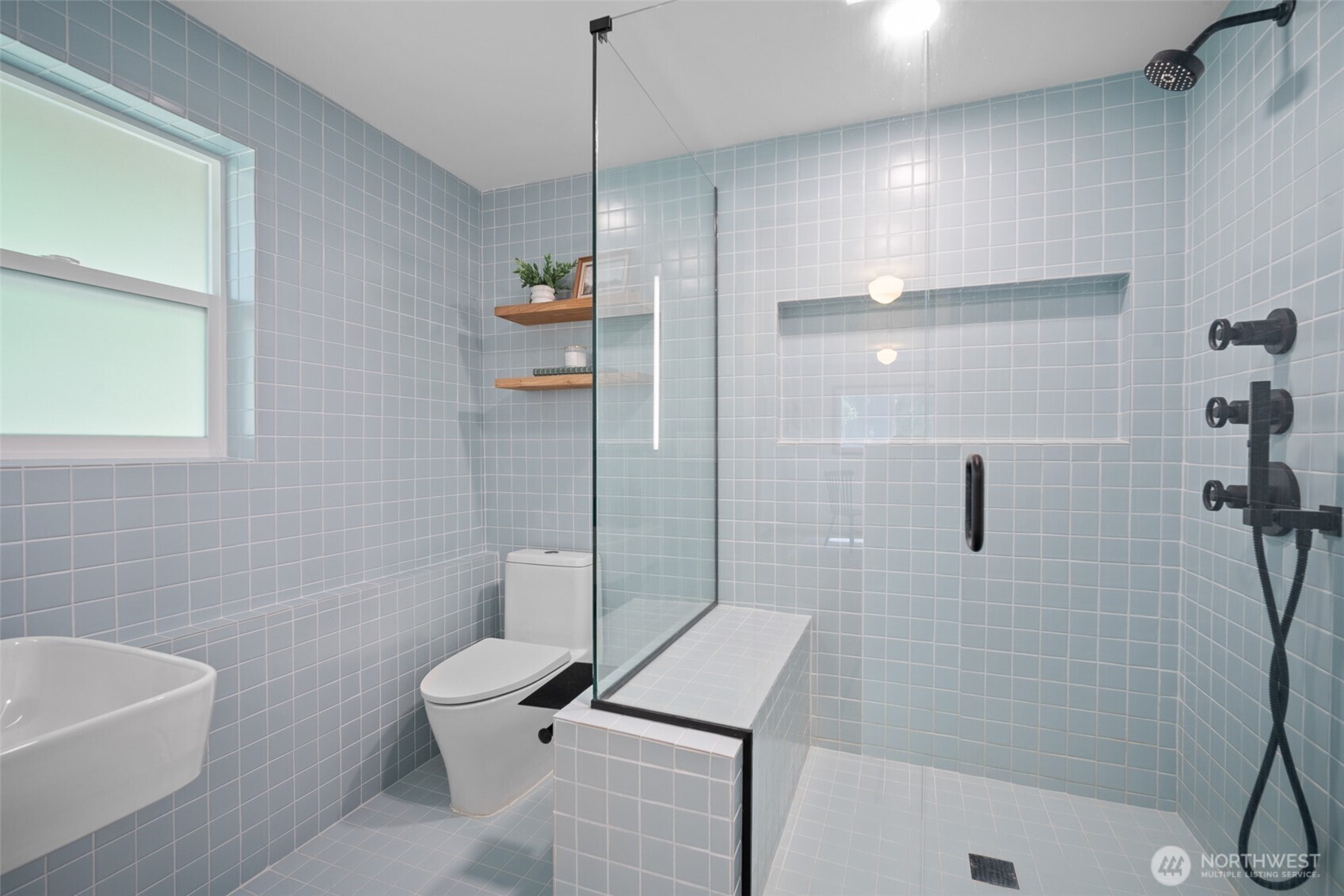 2357 Yew Street Road Bellingham, WA 98229 - Photo 32 of 40 a bathroom with a sink a toilet and shower