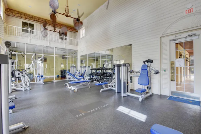 a view of a livingroom with gym equipment